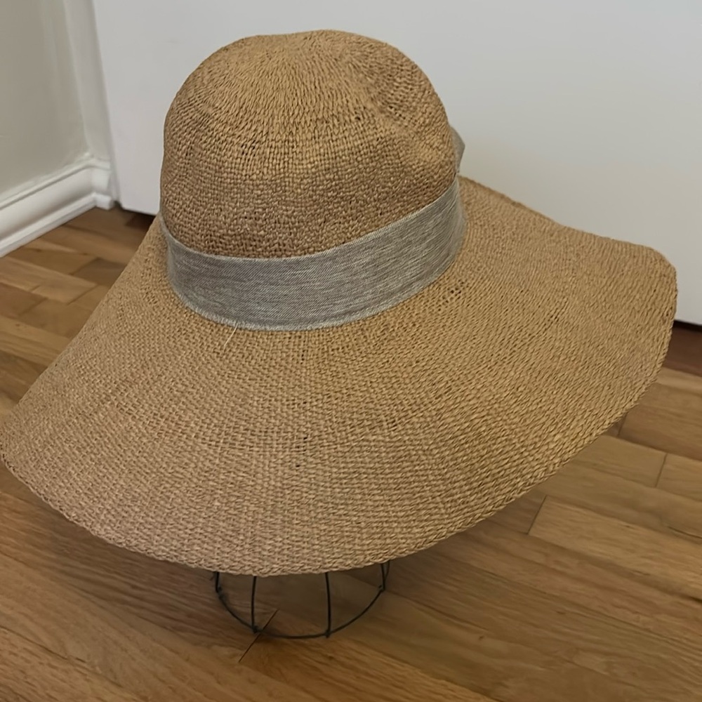 Large brimmed paper hat with bow